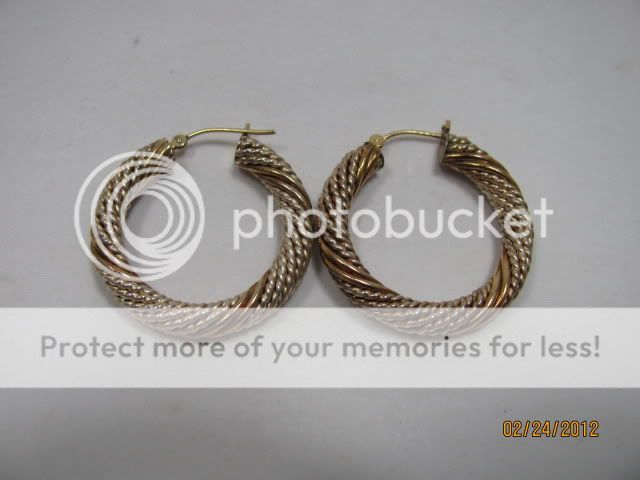 14 Kt Gold earrings marked 5.6 grams  